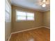 Bedroom featuring hardwood floors, crown molding, a ceiling fan, and natural light from the windows at 1629 Anita Ne Pl, Atlanta, GA 30306