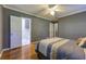 Gray bedroom leads to an ensuite with a toilet, sink, and mirrored medicine cabinet at 1629 Anita Ne Pl, Atlanta, GA 30306