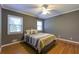 A bedroom boasts natural light, with gorgeous hardwood floors and soothing gray walls at 1629 Anita Ne Pl, Atlanta, GA 30306