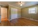 Bedroom with hardwood floors, a window, a closet, and access to storage in hallway at 1629 Anita Ne Pl, Atlanta, GA 30306