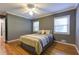 A bedroom boasts natural light, with gorgeous hardwood floors and soothing gray walls at 1629 Anita Ne Pl, Atlanta, GA 30306