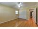 Bedroom featuring hardwood floors, natural light, a ceiling fan, and closet storage space at 1629 Anita Ne Pl, Atlanta, GA 30306