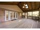 Spacious covered deck featuring wood flooring and ceiling fan providing a great outdoor living space at 1629 Anita Ne Pl, Atlanta, GA 30306