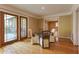 Cozy dining area features hardwood floors, French doors to deck, and glass table with upholstered chairs at 1629 Anita Ne Pl, Atlanta, GA 30306