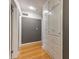 Hallway features hardwood floors and built-in linen cabinets for ample storage at 1629 Anita Ne Pl, Atlanta, GA 30306