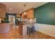 Charming kitchen with granite countertops, stainless steel appliances, hardwood floors, and breakfast bar at 1629 Anita Ne Pl, Atlanta, GA 30306