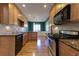 Modern kitchen with stainless steel appliances, granite countertops, hardwood floors and wood cabinetry at 1629 Anita Ne Pl, Atlanta, GA 30306