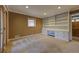 Carpeted living room with built-in shelving, a large window, and French doors to the outside at 1629 Anita Ne Pl, Atlanta, GA 30306