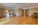 Open-concept living space featuring hardwood floors, recessed lights, seating, and access to other rooms at 1629 Anita Ne Pl, Atlanta, GA 30306