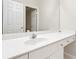 Bright bathroom featuring a white vanity with a sleek countertop and a large mirror, offering a clean and modern aesthetic at 2155 Washington Dr, Douglasville, GA 30135