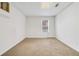 Empty bedroom with neutral walls and carpeting, featuring a window providing natural light at 2155 Washington Dr, Douglasville, GA 30135