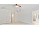 Bright bedroom with vaulted ceiling, neutral carpeting, and an open doorway to a bathroom with a glass-enclosed shower at 2155 Washington Dr, Douglasville, GA 30135