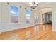Bright dining room featuring hardwood floors, chandelier, and plenty of natural light at 2155 Washington Dr, Douglasville, GA 30135