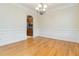 Formal dining room with elegant wainscoting and gleaming hardwood flooring at 2155 Washington Dr, Douglasville, GA 30135