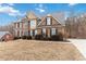 Traditional brick home with a well-manicured lawn and mature landscaping at 2155 Washington Dr, Douglasville, GA 30135