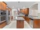 Modern kitchen boasts stainless steel appliances, granite countertops, and a center island at 2155 Washington Dr, Douglasville, GA 30135