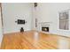 Spacious living room with a fireplace, soaring ceilings, and hardwood floors at 2155 Washington Dr, Douglasville, GA 30135