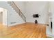 Open-concept living room with hardwood floors, a fireplace, and plenty of space at 2155 Washington Dr, Douglasville, GA 30135