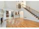 Spacious living room features a fireplace, hardwood floors, and an open staircase at 2155 Washington Dr, Douglasville, GA 30135