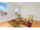 Bright living room with hardwood floors, two chairs, and lots of natural light at 2155 Washington Dr, Douglasville, GA 30135