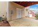 Exterior patio with concrete flooring, an open, covered red wooden deck, and house siding at 2155 Washington Dr, Douglasville, GA 30135