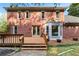 Charming backyard with a wooden deck, brick exterior, and well-maintained lawn at 2804 Livsey Woods Dr, Tucker, GA 30084