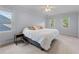 Spacious bedroom with neutral walls, carpet, ceiling fan, and windows providing lots of natural light at 2804 Livsey Woods Dr, Tucker, GA 30084