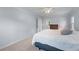 A bright bedroom shows a light-blue painted wall and neutral-colored carpet and white trim at 2804 Livsey Woods Dr, Tucker, GA 30084