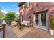 Relax on this cozy deck with seating overlooking the backyard and a brick exterior at 2804 Livsey Woods Dr, Tucker, GA 30084