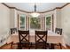 Cozy dining area with large windows overlooking the backyard at 2804 Livsey Woods Dr, Tucker, GA 30084