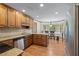 Kitchen featuring wooden cabinets, granite countertops, and a breakfast nook with bay windows at 2804 Livsey Woods Dr, Tucker, GA 30084
