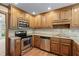 Well-equipped kitchen with granite countertops, stainless steel appliances, and ample cabinet space at 2804 Livsey Woods Dr, Tucker, GA 30084