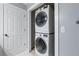 Bathroom closet with a stackable washer and dryer at 2804 Livsey Woods Dr, Tucker, GA 30084