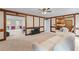 An airy living room showcasing light walls, white furniture, and seamless transitions to other living spaces at 2804 Livsey Woods Dr, Tucker, GA 30084