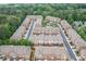 Aerial view of a beautiful townhouse community with well-kept landscaping and street access at 2528 Magnolia Ridge Dr, Marietta, GA 30067