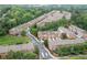 Aerial view of a community featuring well-maintained townhomes, lush trees, and green spaces at 2528 Magnolia Ridge Dr, Marietta, GA 30067