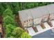An aerial view of townhomes featuring brick facades, well-manicured landscaping, and individual driveways for each unit at 2528 Magnolia Ridge Dr, Marietta, GA 30067