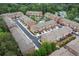 Aerial view of a townhouse community with tree-lined streets and well-manicured lawns at 2528 Magnolia Ridge Dr, Marietta, GA 30067