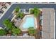 An aerial view of a well-kept neighborhood pool with lounge chairs, a clubhouse, and mature landscaping at 2528 Magnolia Ridge Dr, Marietta, GA 30067