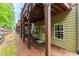 View of the home's exterior with back door entry, wood siding and a mulch bed covered in pine straw at 2528 Magnolia Ridge Dr, Marietta, GA 30067