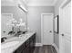 Bathroom features a large mirror, double vanity, and dark wood cabinets at 2528 Magnolia Ridge Dr, Marietta, GA 30067