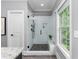 The renovated bathroom features a glass shower and tiled floors at 2528 Magnolia Ridge Dr, Marietta, GA 30067