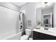 Bathroom featuring tub, shower, and vanity with modern fixtures at 2528 Magnolia Ridge Dr, Marietta, GA 30067