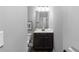 Bathroom features a dark vanity, stylish mirror, and fixtures at 2528 Magnolia Ridge Dr, Marietta, GA 30067