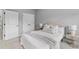 Cozy bedroom featuring a large bed, neutral decor, and natural light from the adjacent windows at 2528 Magnolia Ridge Dr, Marietta, GA 30067