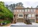 Charming brick townhome with a two-car garage and professionally landscaped front yard at 2528 Magnolia Ridge Dr, Marietta, GA 30067