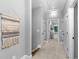 Hallway features neutral walls, carpeted floors and doorway to a sunlit room at 2528 Magnolia Ridge Dr, Marietta, GA 30067