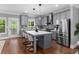 Modern kitchen featuring gray cabinetry, stainless steel appliances, and a center island at 2528 Magnolia Ridge Dr, Marietta, GA 30067