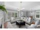Spacious living room featuring modern lighting, large windows, and hardwood floors at 2528 Magnolia Ridge Dr, Marietta, GA 30067