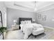 Serene bedroom with neutral colors, soft lighting, tray ceiling, and a decorative rug at 2528 Magnolia Ridge Dr, Marietta, GA 30067